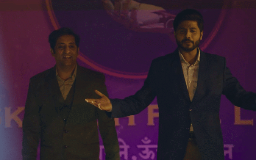 Still from The Networker showing Vikram Kochhar and Durgesh Kumar plotting their AI scam business in a comedic crime-drama setting